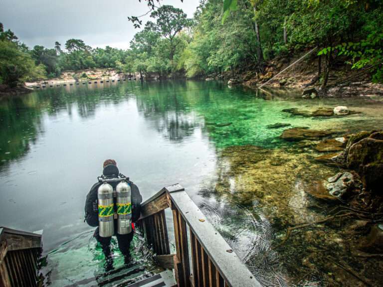 Diver gets ready to scuba dive at Troy Springs State Park