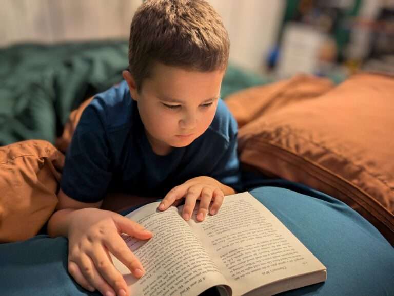 Dom in his room reading Charlotte's Web